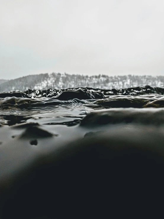 an image of a picture of mountains and waves