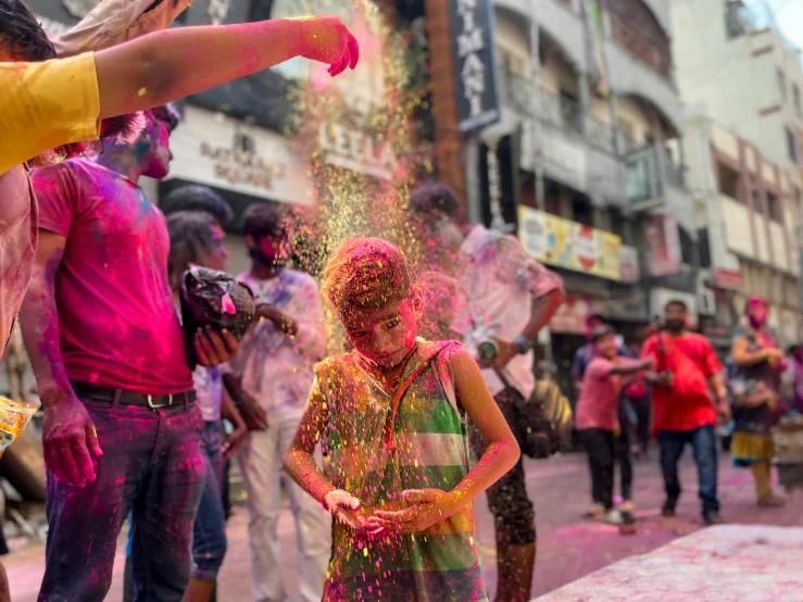 people throwing colors around at the festival