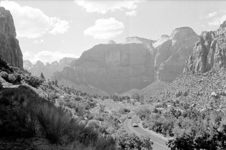 a mountain view looking down at the road below