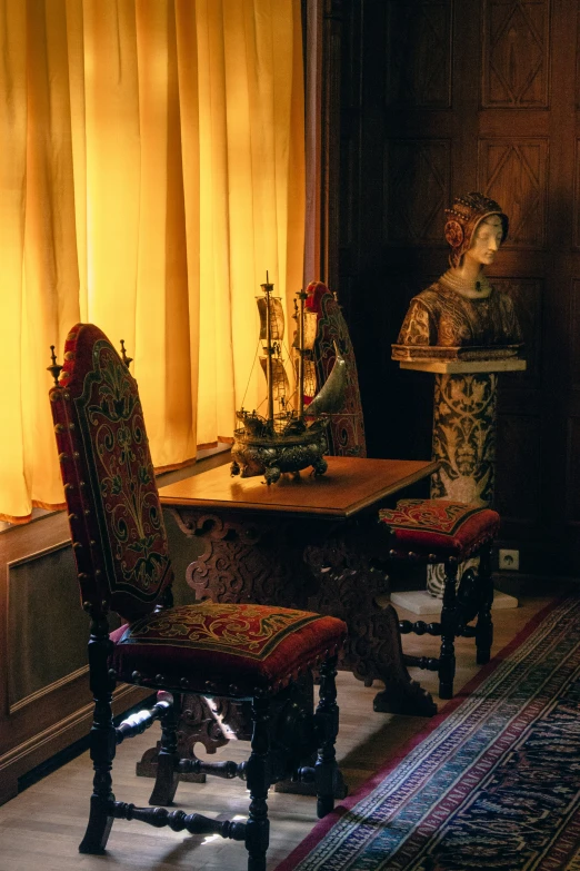 an image of a table and chairs with flowers