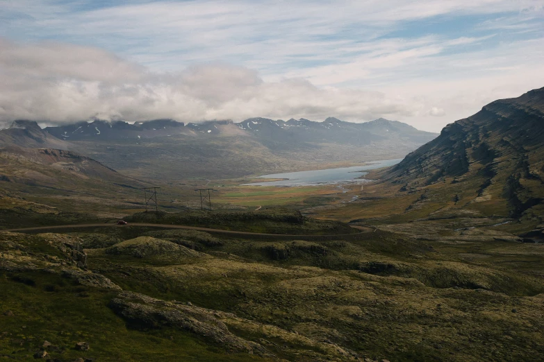 a mountainous landscape with lush green grass