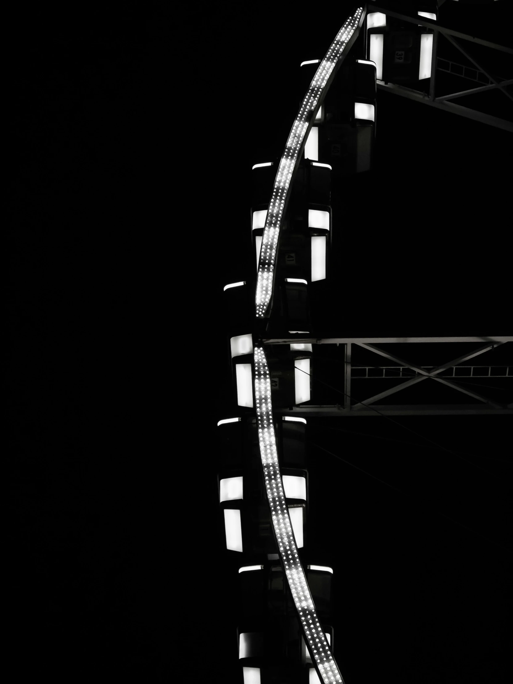 the black and white po shows a ferris wheel