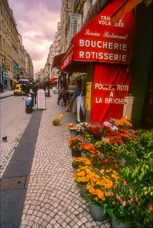 a street with flowers growing outside of it