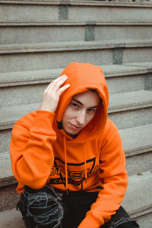 a young person that is sitting on the steps