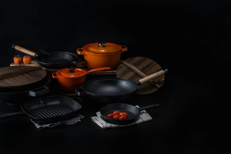 a group of kitchen tools on a black surface