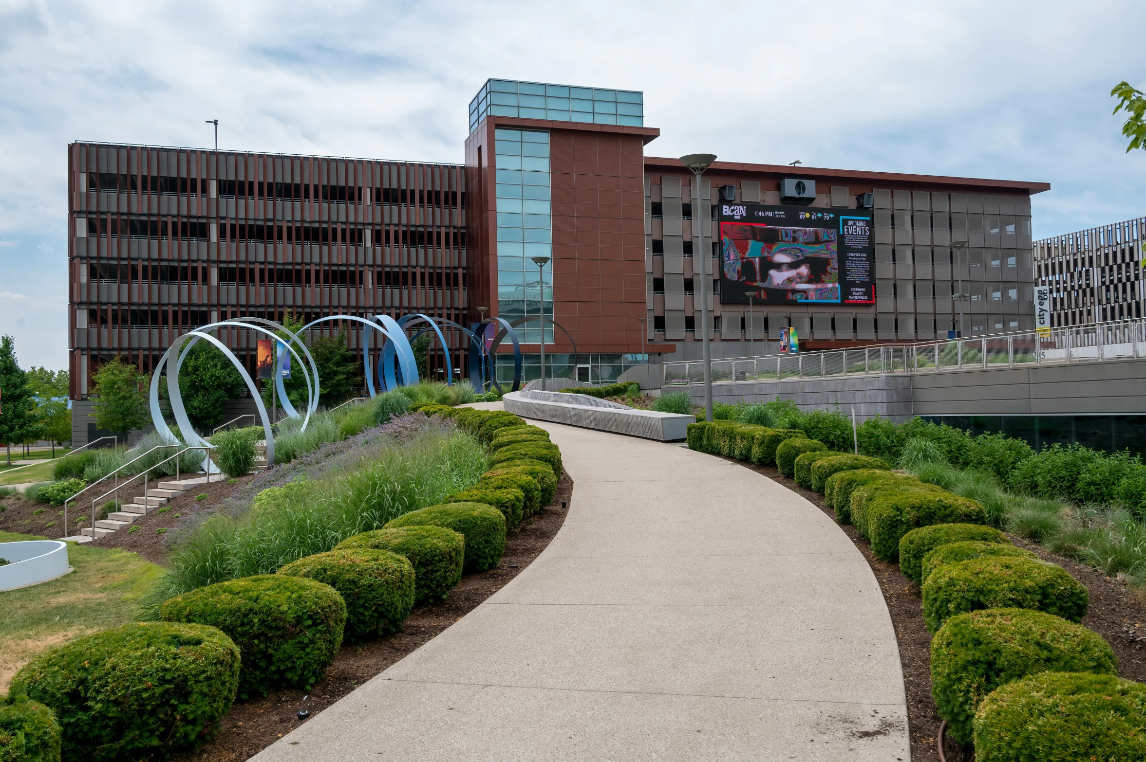 the path passes the huge building in a park