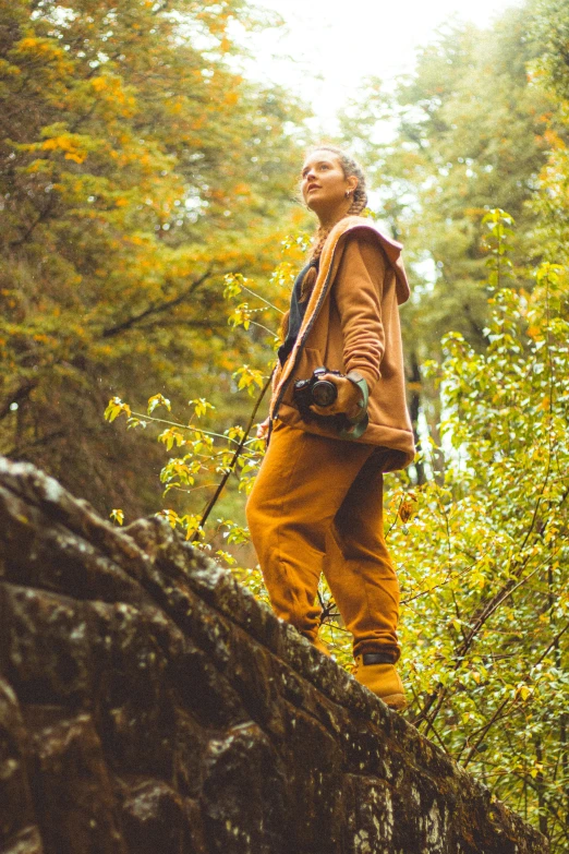 a man with a backpack walking through a forest