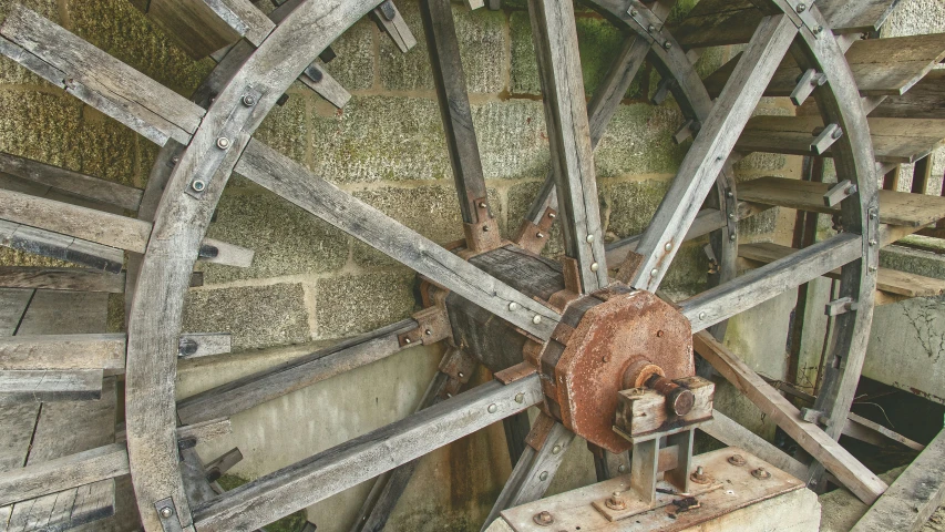 the old wagon wheel is in a wood barn