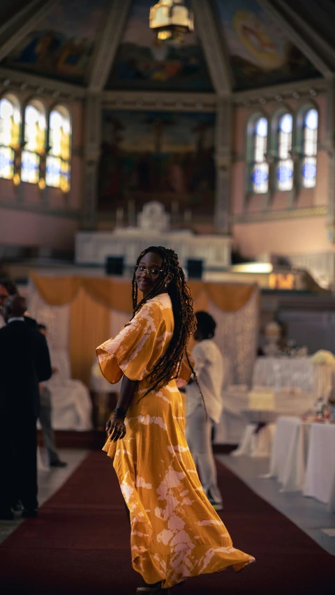 a woman standing on the ground in a church