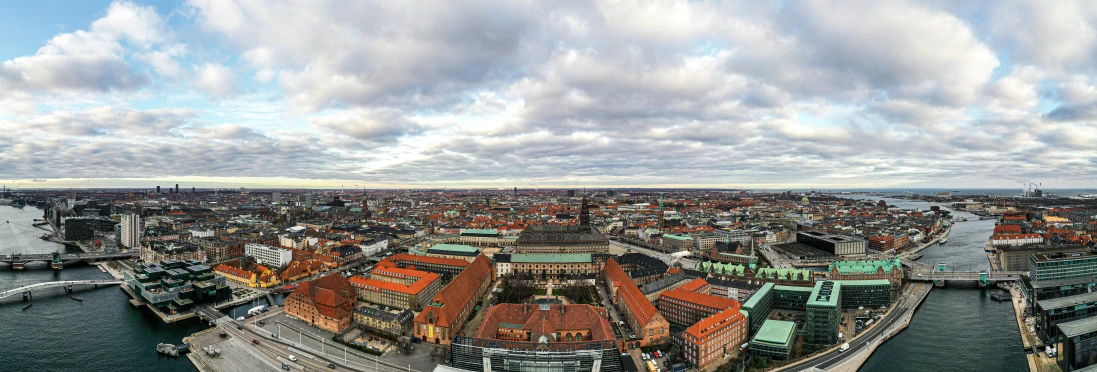 an aerial view of buildings next to the water