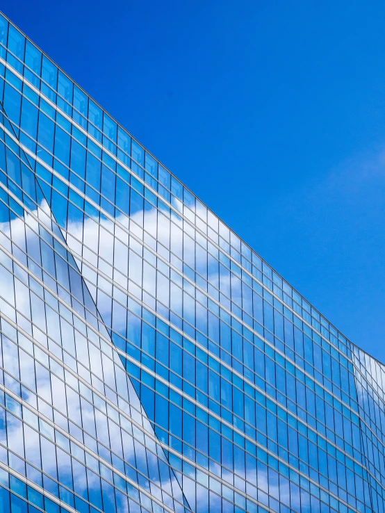 a blue sky with some white clouds in the background