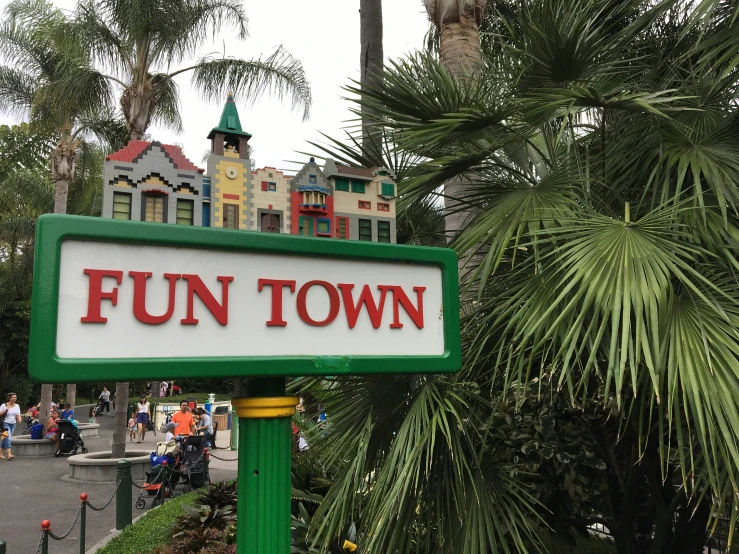 the sign for fun town stands in front of a building