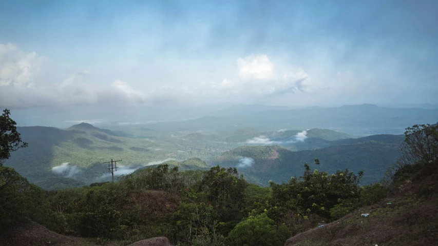 landscape s of a mountainous area with clouds in the distance