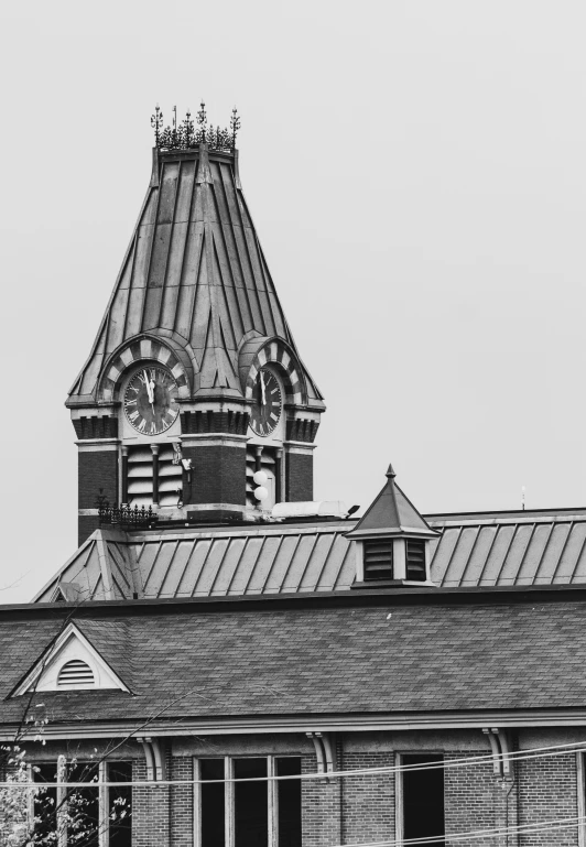 a clock tower with some windows next to a building