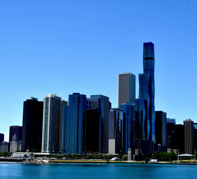 the cityscape appears to be near an old bridge over a large body of water