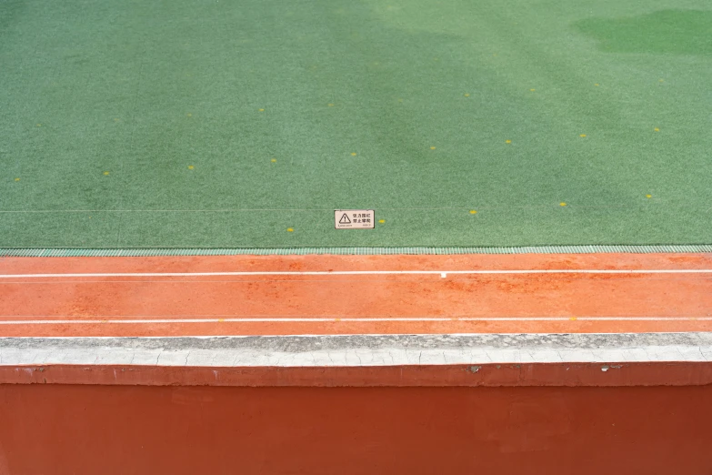 there is a picture of the green and orange baseball field