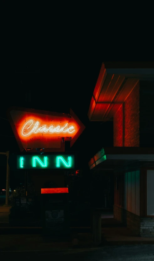 neon signs line the side of a building