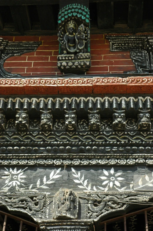 there is an ornate design at the top of a building