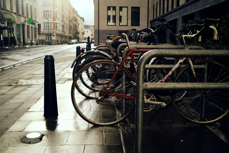 an image of a bunch of bicycles parked at a bike rack