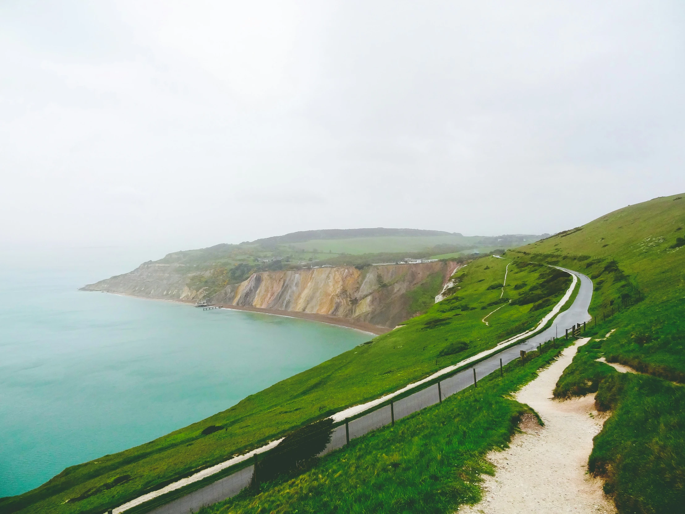 a road winding the side of the hill