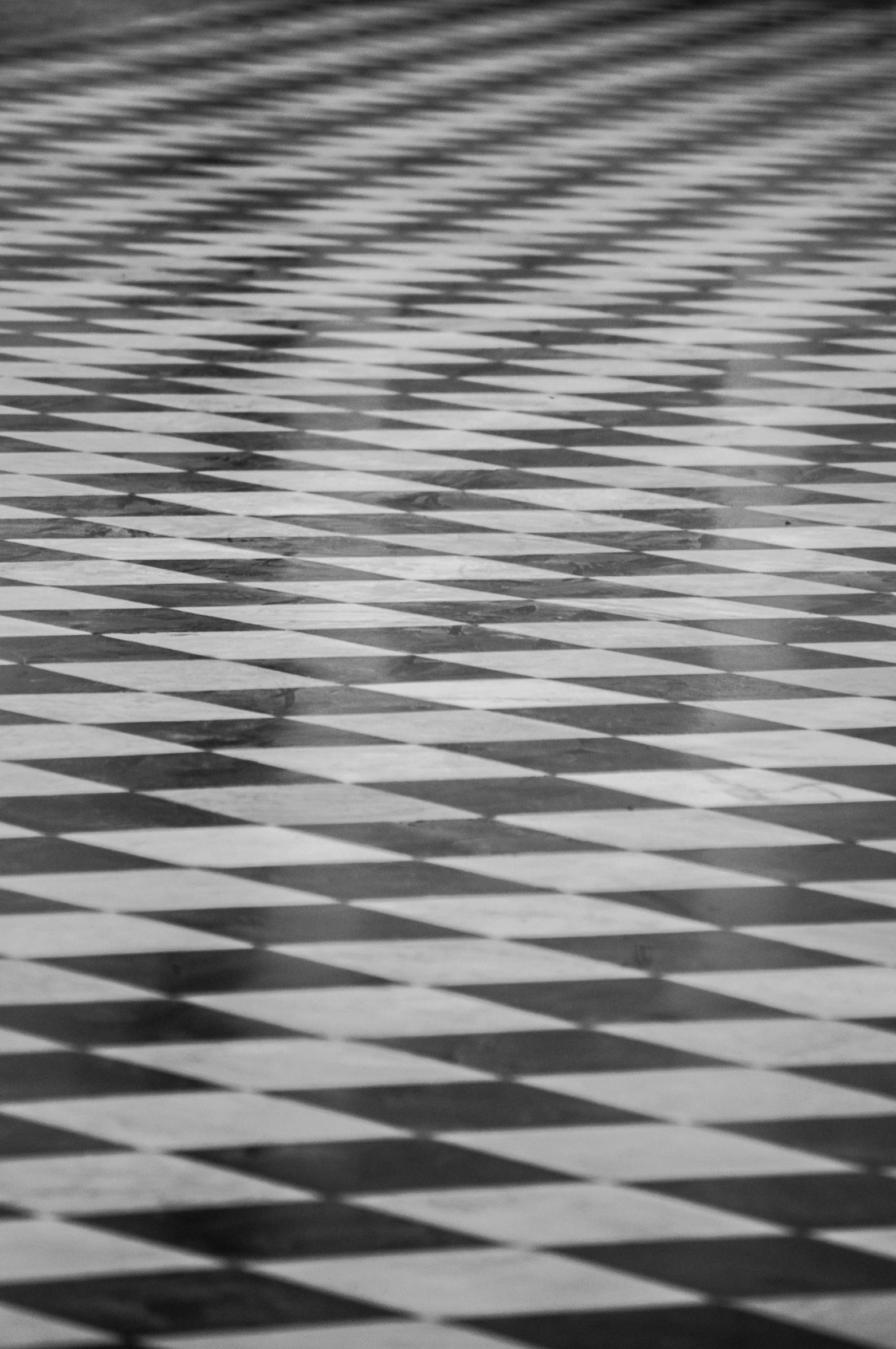 a black and white tiled floor with checkerboard pattern
