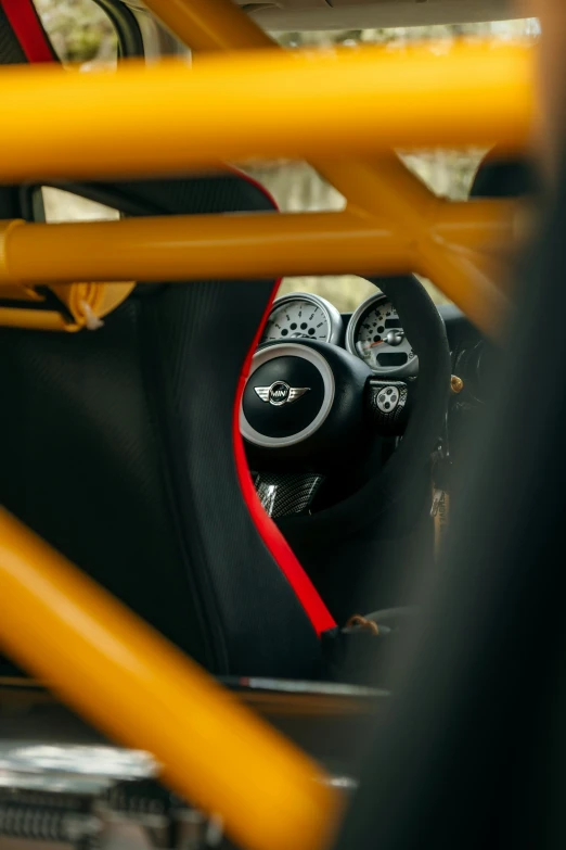 the steering wheel on a car with red stripes