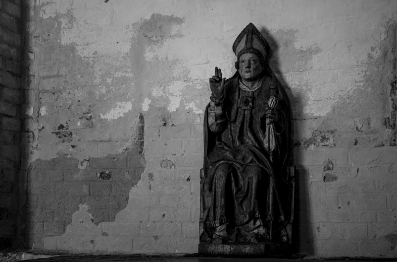 a black and white po of a statue in a church