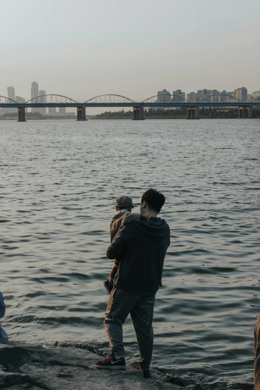 a group of guys looking at the water