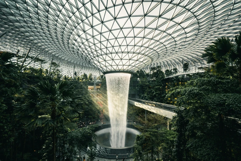 a fountain inside a building with several walls