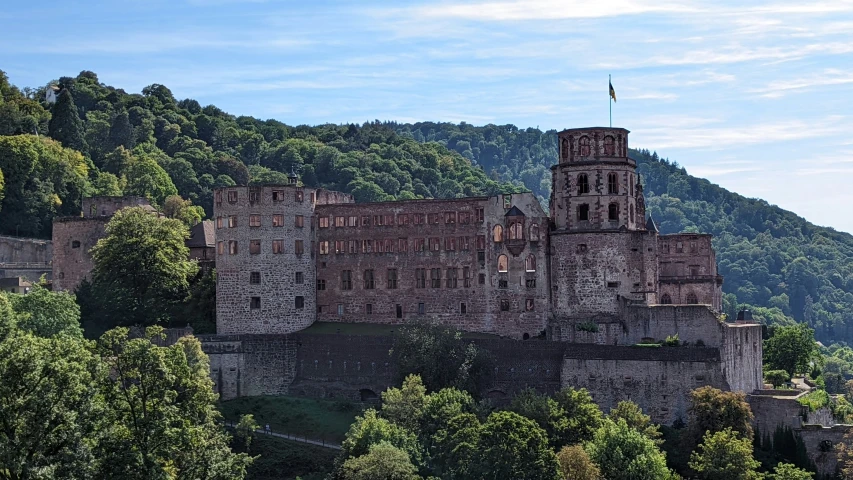 an old castle that is in the middle of trees