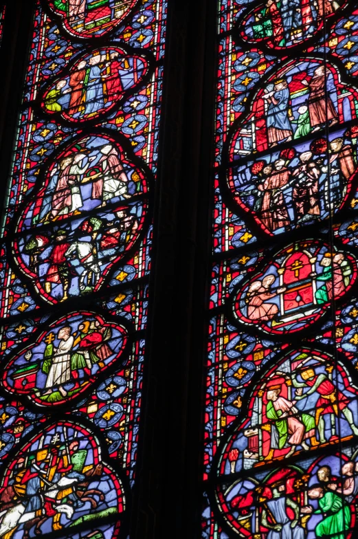 the large stained glass windows in the cathedral depict biblical characters