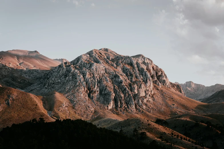 a mountain range with brown mountains behind it