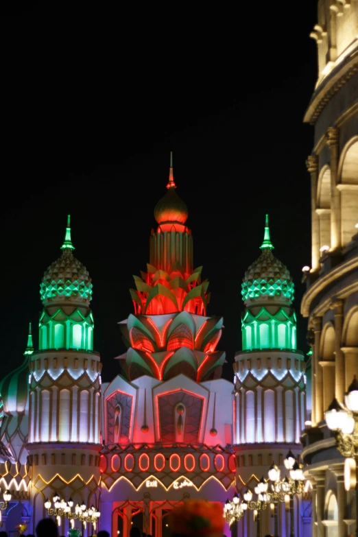 an ornate building lit up in various colors