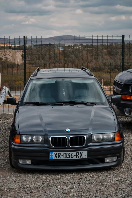 the black car has chrome on it's grilles and hood