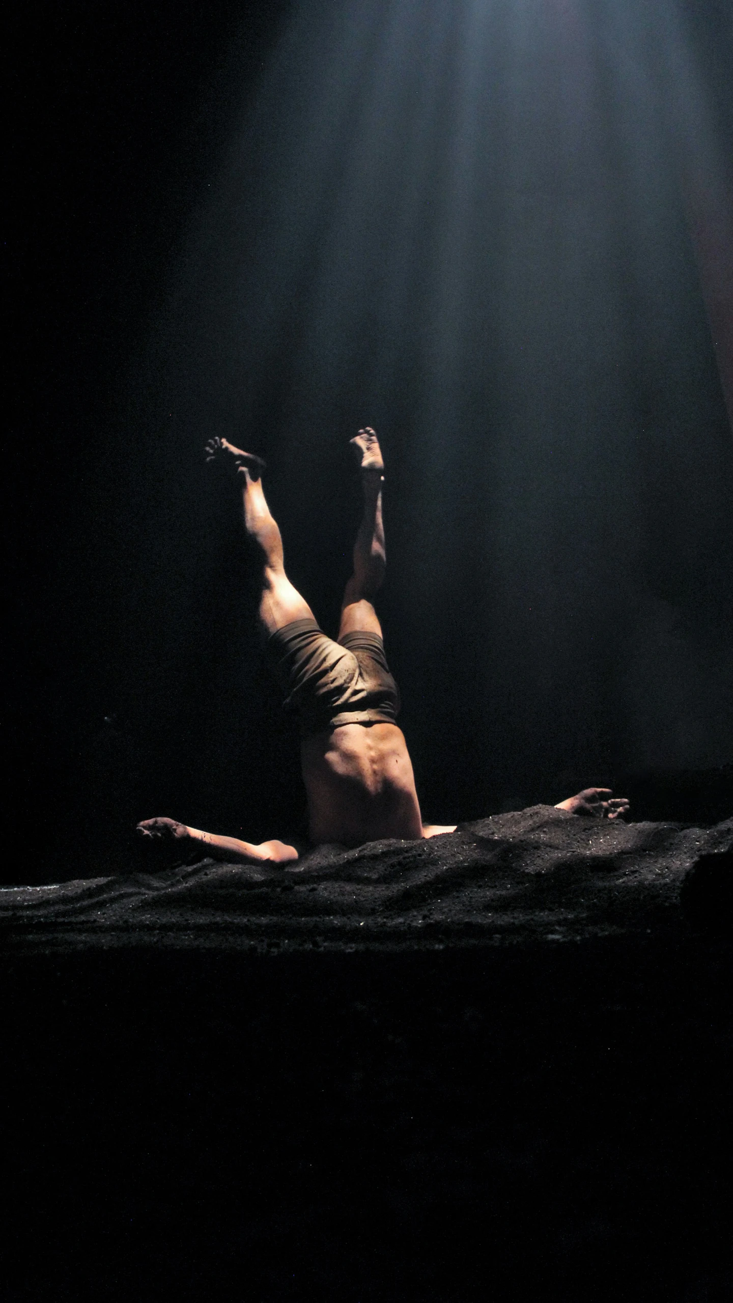 a woman lying on her stomach while touching the ceiling