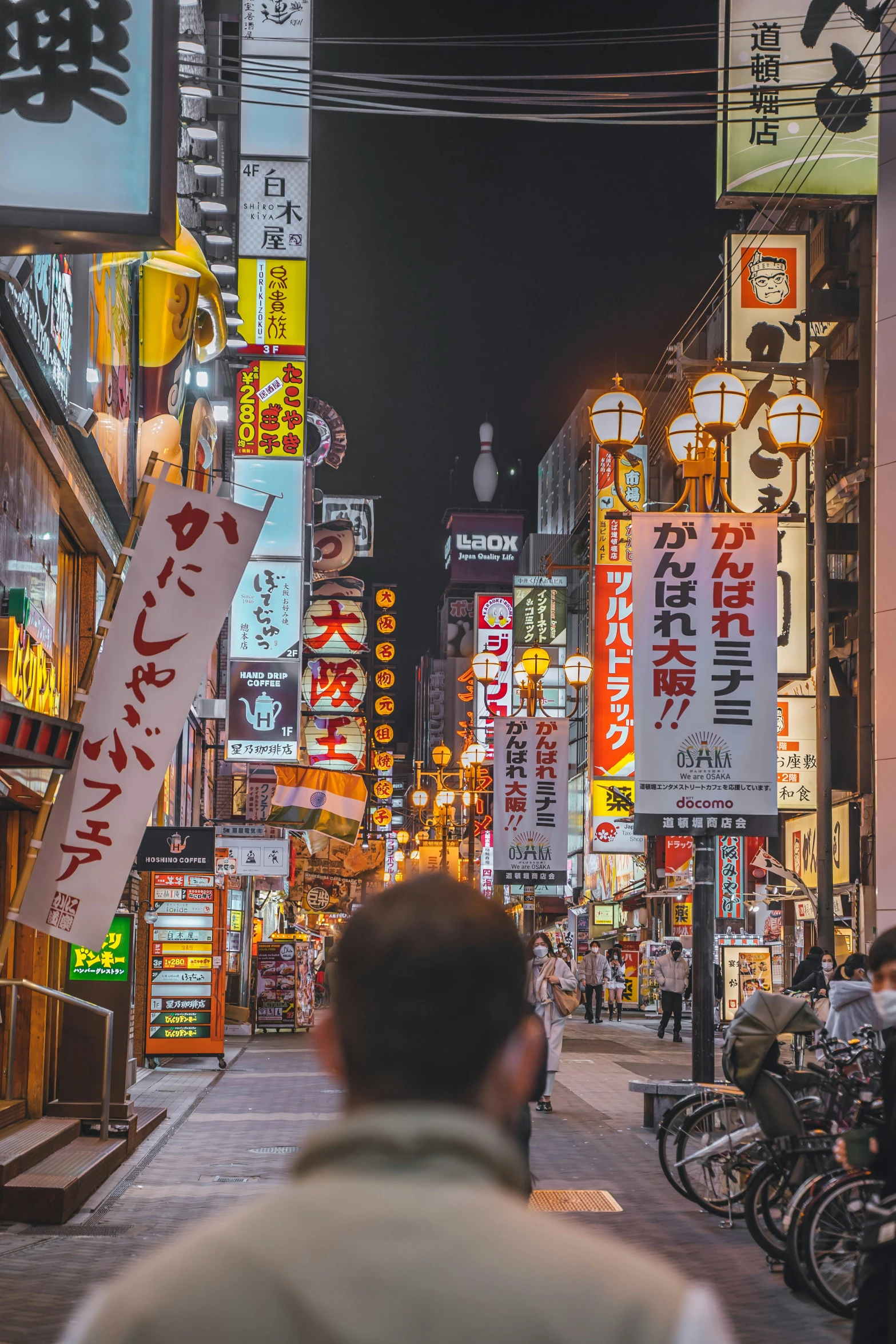 the street is crowded with business signs and people