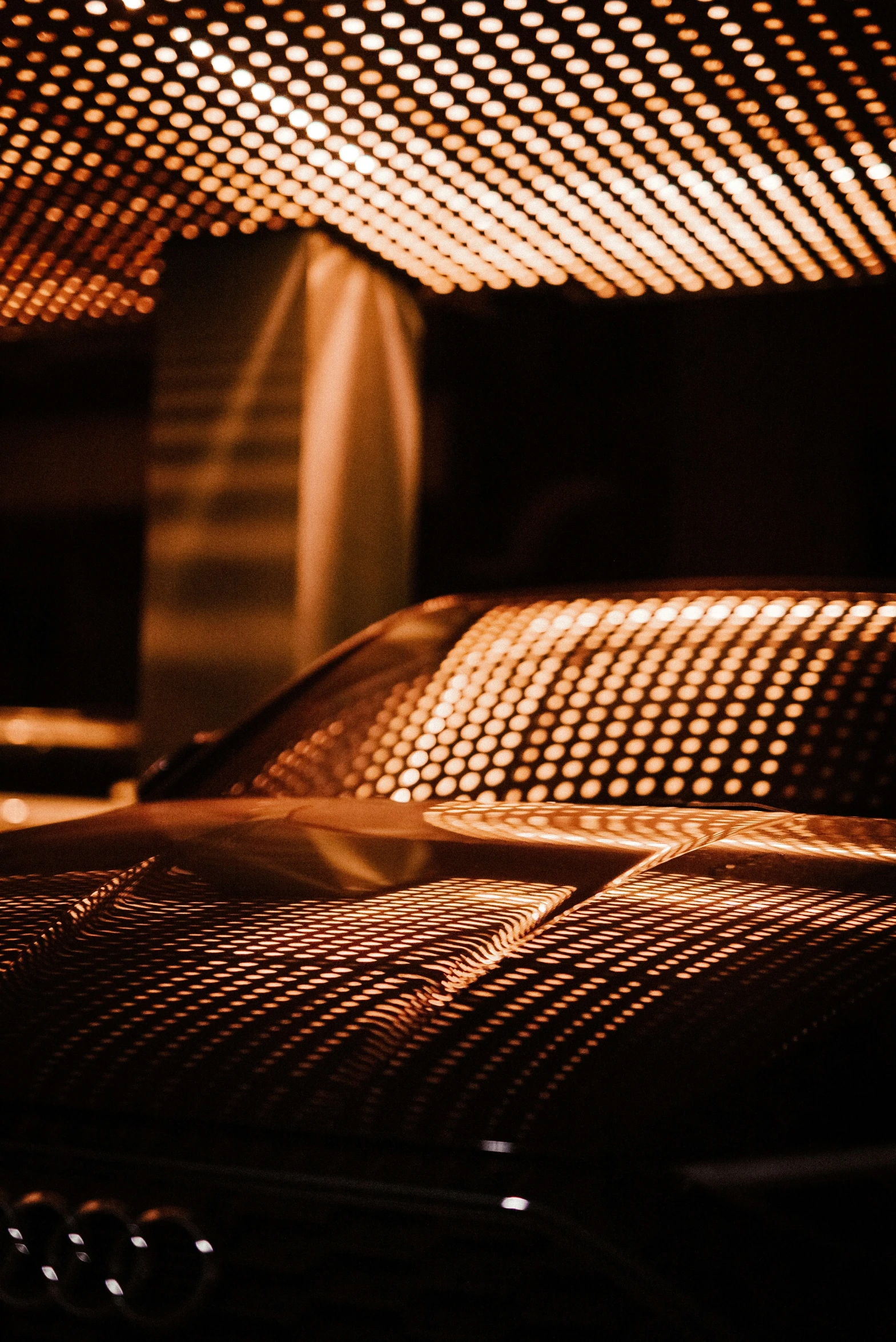 a close up of some lights that are shining down on a building