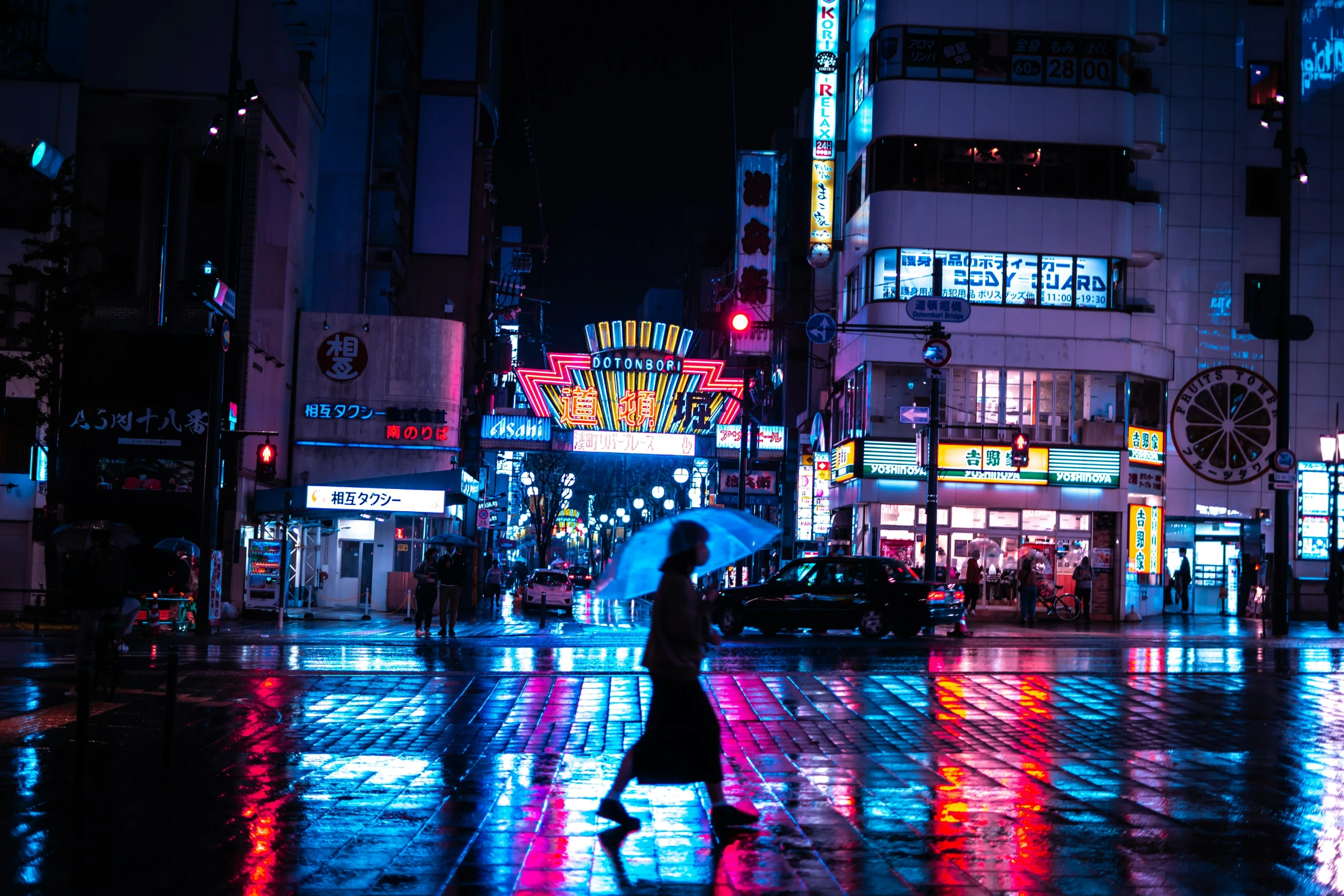 a dark night in an oriental town lit by street lights