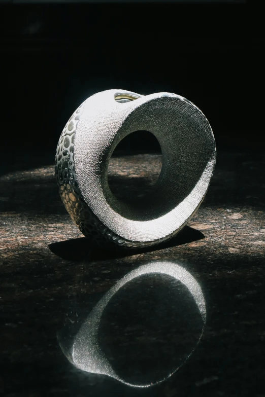 a silver object that is on top of a table