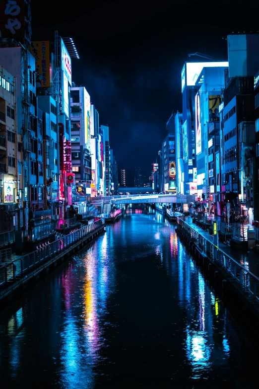 an urban canal runs through a city at night