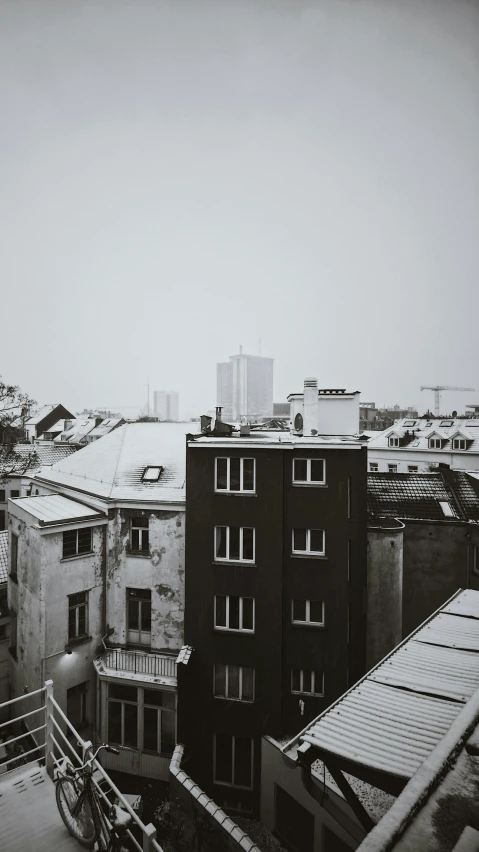 a building with rooftop tops in the snow