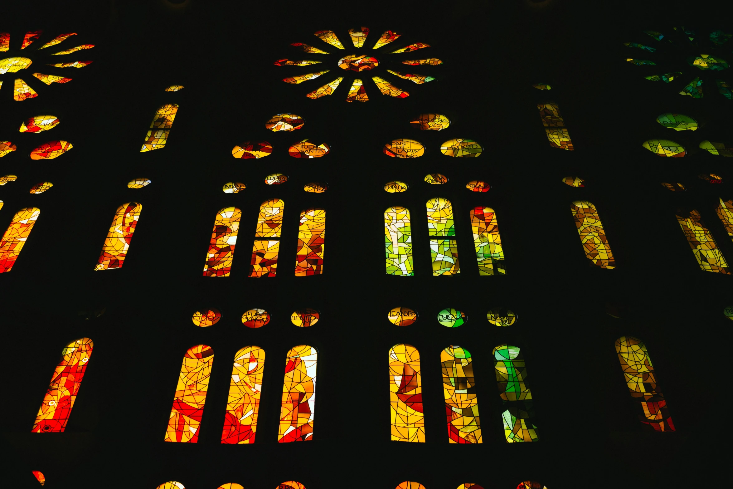 the stain glass window shows a sun design