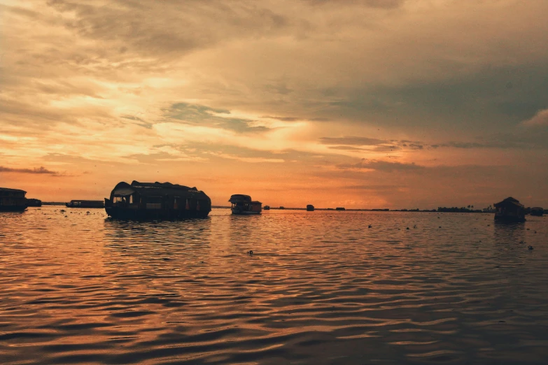 a boat in the distance on an orange colored river