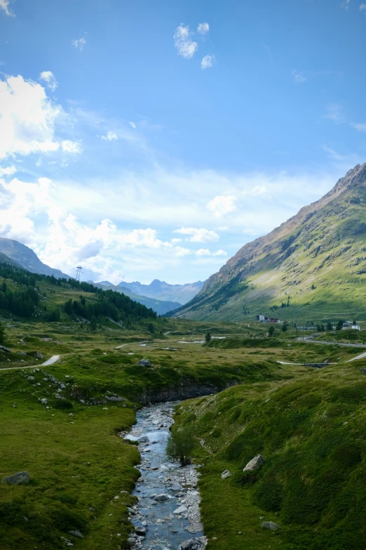 a very pretty river that is running through a big mountain