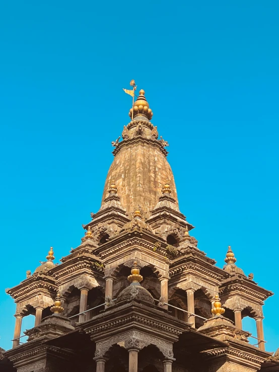 view from below of gold colored ornate building