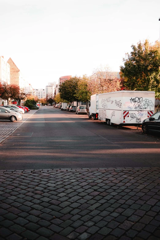 a large street with cars and trucks on it