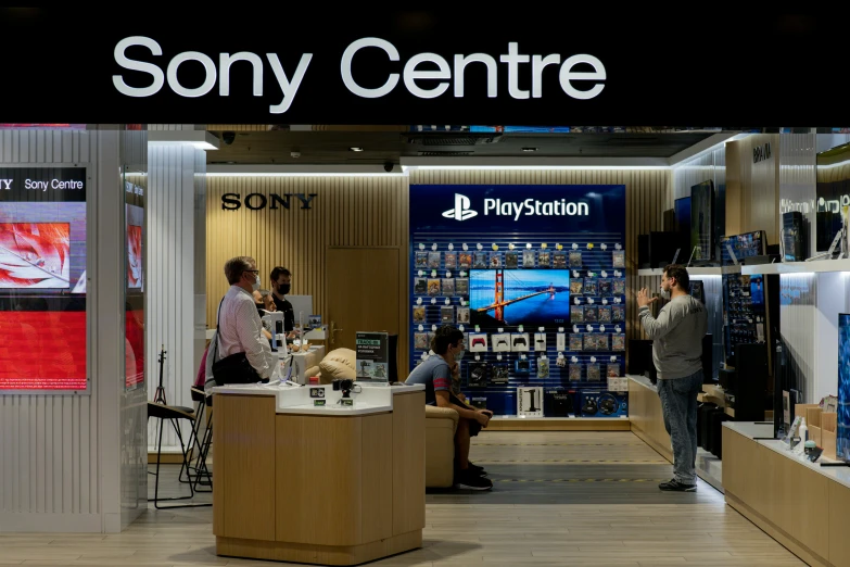 a store has sony games and displays on the wall