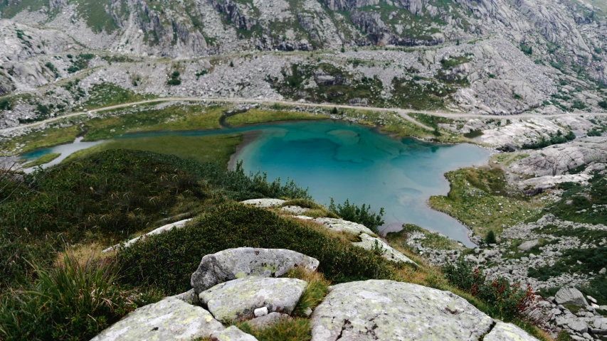 a small lake on top of a hill