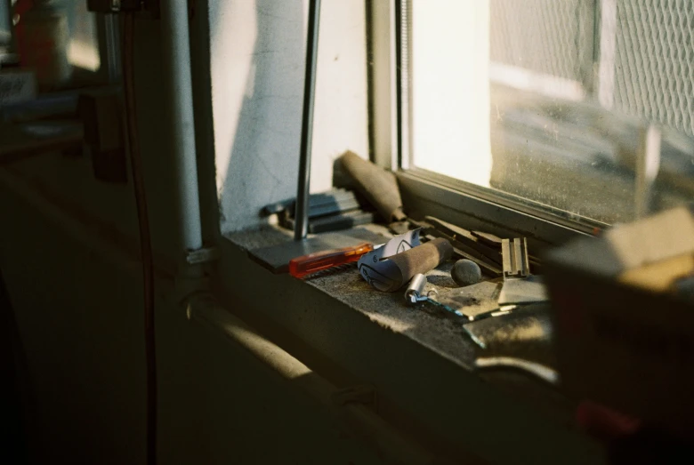 small objects rest on top of a small metal shelf