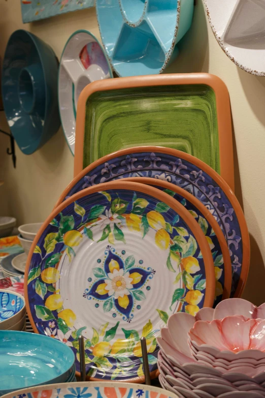 a bunch of dishes are on the shelf together